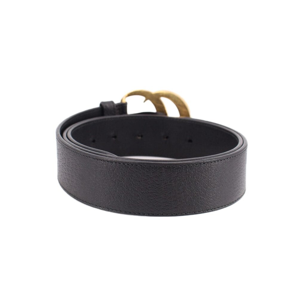 Black leather belt with inner holes and smooth strap, no buckle detail