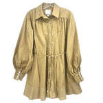Tan long-sleeve dress with button front, collar, gathered yoke, and tied waist string