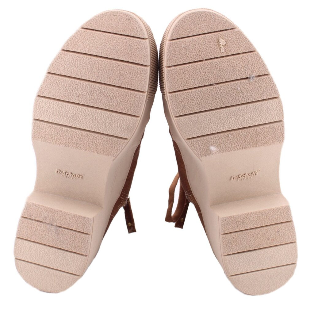 Booties outsoles with textured tread and light-colored undersoles