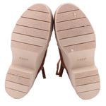 Booties outsoles with textured tread and light-colored undersoles