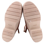 Booties outsoles with textured tread and light-colored undersoles