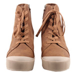 Pair of brown lace-up ankle booties with white wedge sole