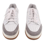 Pair of white low-top sneakers with gray toe panel, lace-up and SAINT LAURENT detail