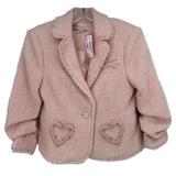 Pink tweed blazer with ruffled lapel and heart-shaped embellishments