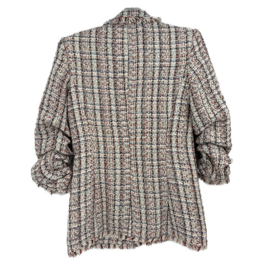 Back view of white/red tweed blazer with frayed hem and three-quarter puff sleeves