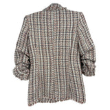 Back view of white/red tweed blazer with frayed hem and three-quarter puff sleeves