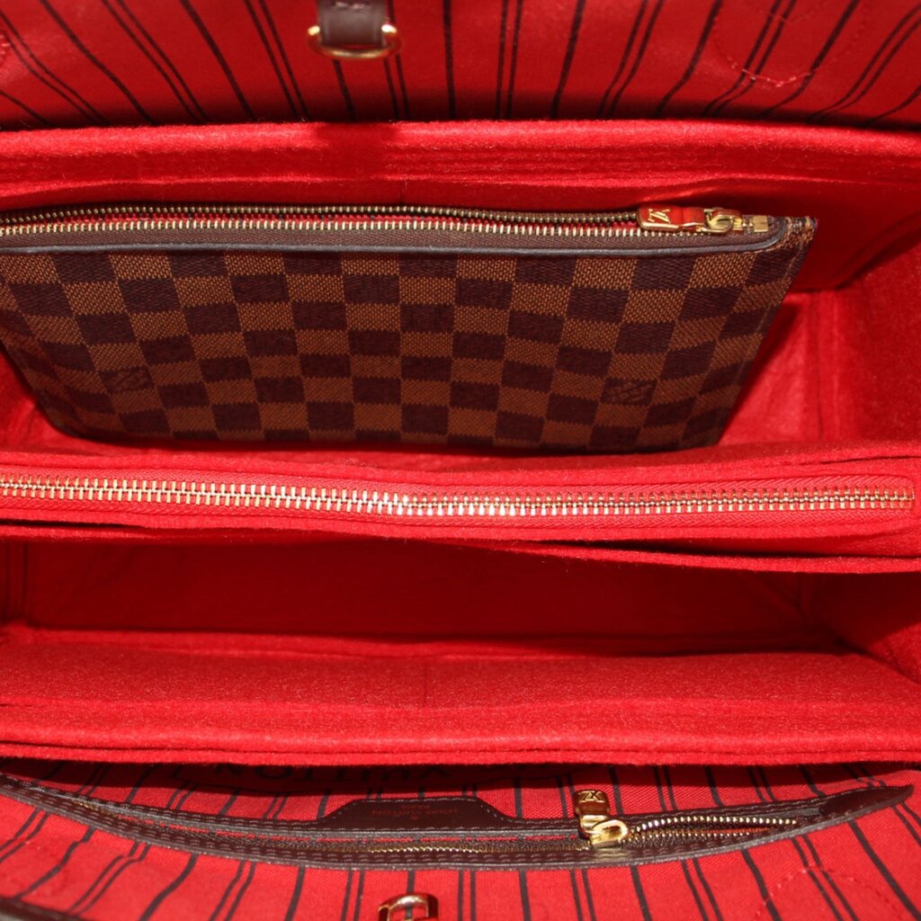Damier Ebene tote interior with red lining and zip pocket view