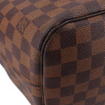 Damier Ebene check tote corner close-up with rounded edge and dark trim
