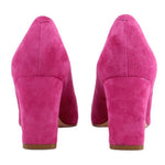 Pink suede pumps with block heels, back view showing heel counters