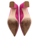 Pink suede pointed pumps showing inner lining and brown-tinted insoles