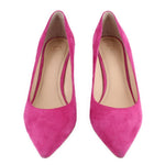 Pair of pink suede pointed-toe pumps with block heels, front view