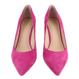 Pair of pink suede pointed-toe pumps with block heels, front view