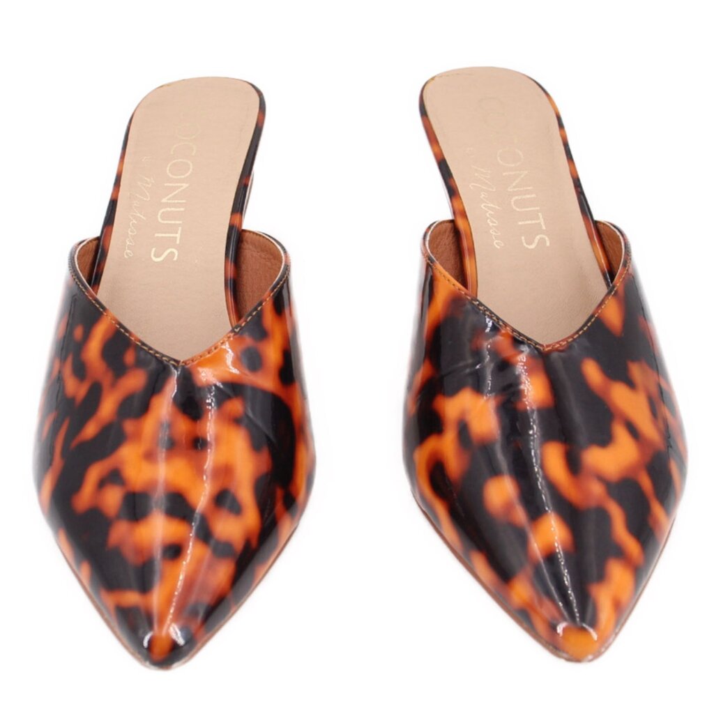 Pair of brown tortoise patent mules, open back with pointed toe and low heel