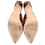Brown tortoise patent mule heels, beige insoles and pointed toe profile