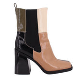 Black and tan patchwork chelsea-style ankle booties with block heel