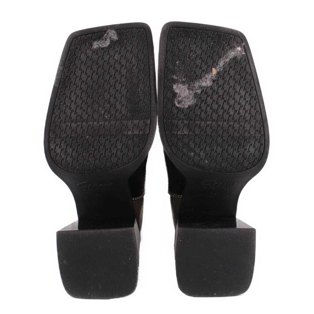 Black patchwork bootie heels and treaded outsoles