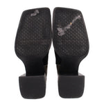 Black patchwork bootie heels and treaded outsoles