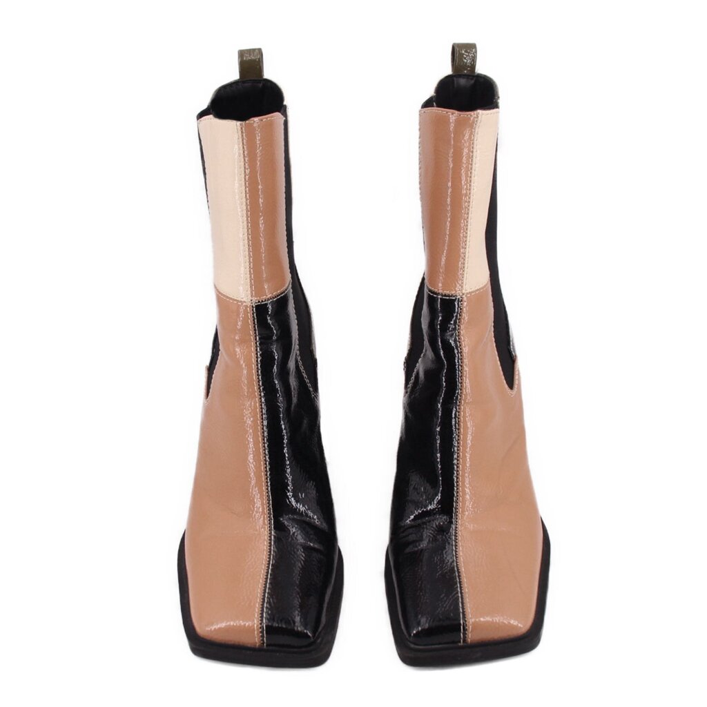 Black and tan patchwork ankle booties, side view with pull tabs