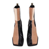 Black and tan patchwork ankle booties, side view with pull tabs