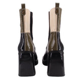 Black and tan patchwork ankle booties with stacked block heel, back view
