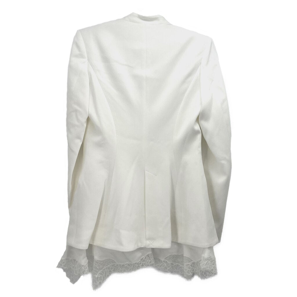 Two-button white blazer back view with tailored seams and lace-trim hem
