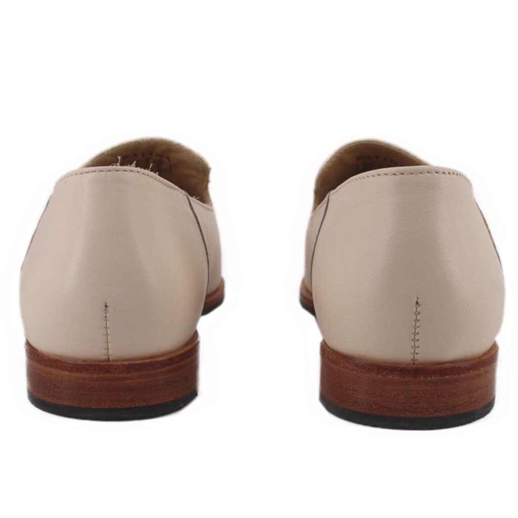 Cream pointed flats with back seam stitching and brown outsole