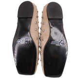 Tan stud flats outsole view with black sole and cushioned insole
