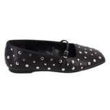 Black slip-on flats with adjustable strap and silver-tone studs all over