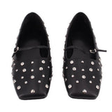 Pair of black pointed-toe flats with silver-tone studs and low-profile strap