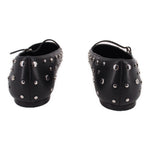 Black flats with side profile strap and silver-tone metal studs around upper