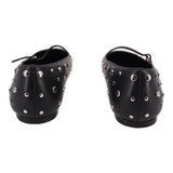 Black flats with side profile strap and silver-tone metal studs around upper
