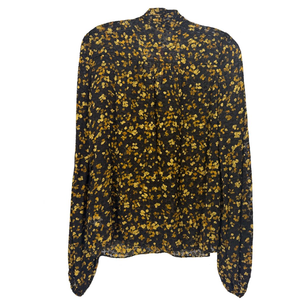 Back of the black floral blouse, showing long sleeves and a gathered upper-back seam