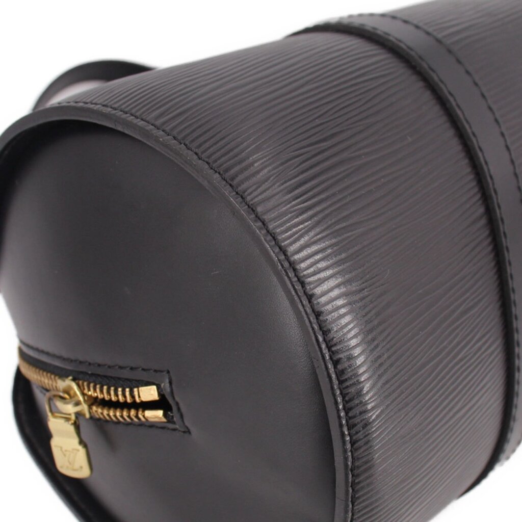 Black mini pouch bag with gold-tone zipper pull and corner leather stitching