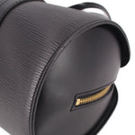 Black leather-look bag with gold-tone zipper and textured paneling
