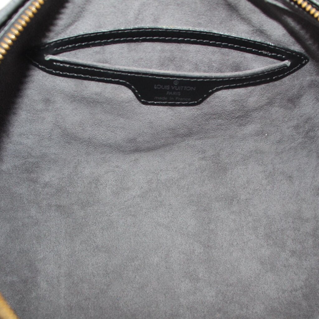 Black bag interior with stitched LOUIS VUITTON label and smooth lining