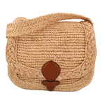 Natural raffia small messenger bag with flap and brown leather buckle detail