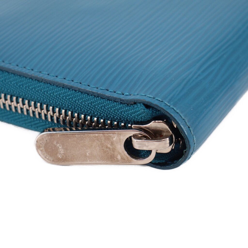 Teal Epi zip wallet close-up of metal zipper pull
