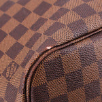 Damier Ebene tote bag close-up of stitched fabric edge with brown textured trim