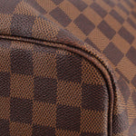 Damier Ebene tote bag close-up of corner seam on checkered canvas