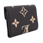 LOUIS VUITTON Victorine wallet side view with black leather and beige monogram pattern