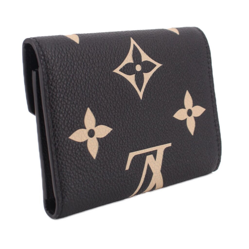 Black leather wallet with beige monogram flowers, snap flap and gold-tone emblem