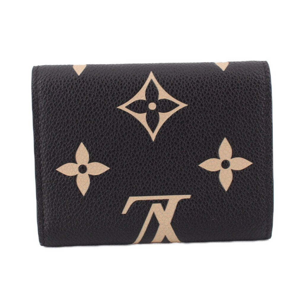 LOUIS VUITTON Victorine bifold wallet, black leather with beige floral monogram accents