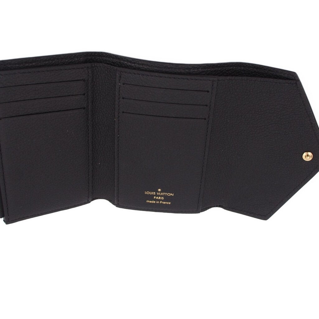 Black leather wallet interior with multiple card slots and central label text