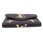 LOUIS VUITTON Victorine wallet back view in black leather with beige monogram and snap