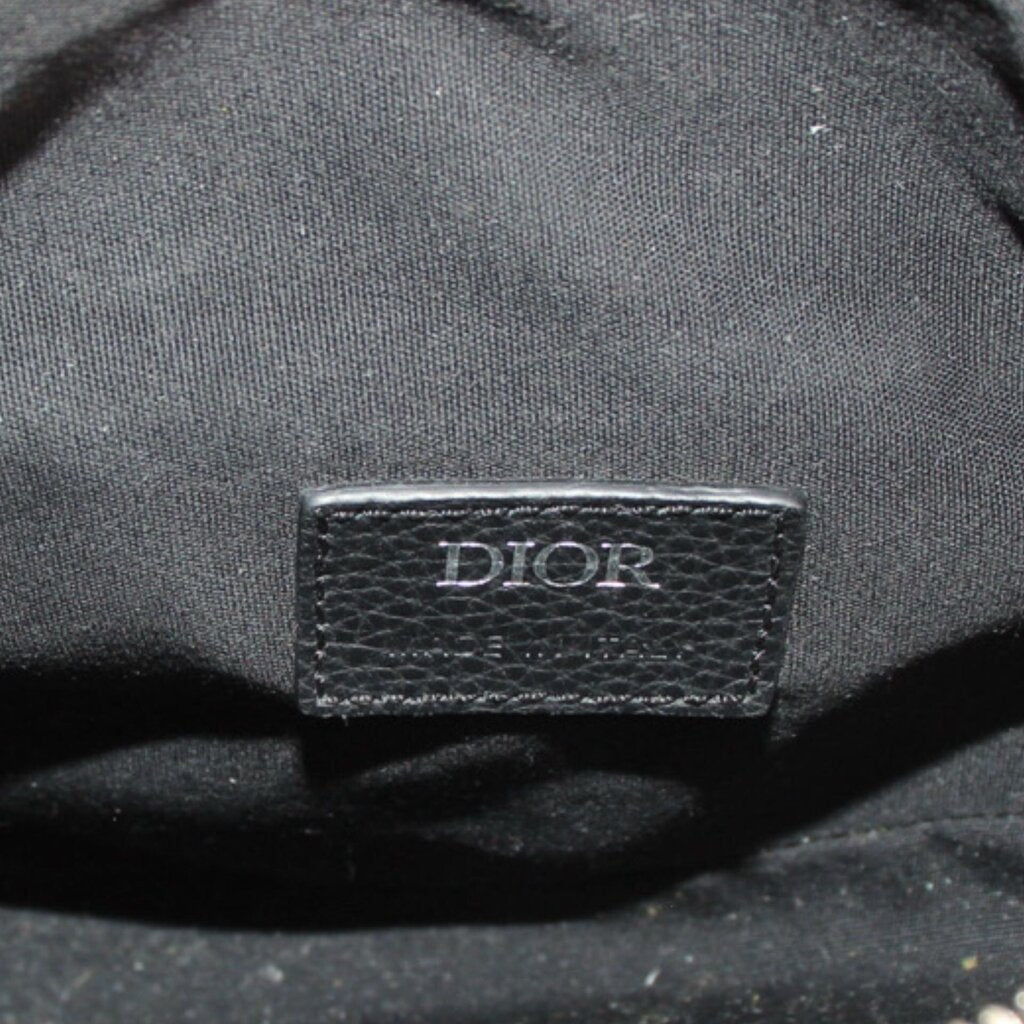 DIOR logo leather label on black interior of jacquard saddle crossbody bag