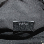 DIOR logo leather label on black interior of jacquard saddle crossbody bag