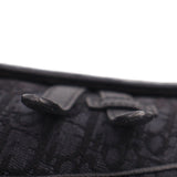 Close-up of black jacquard bag zipper track along top edge