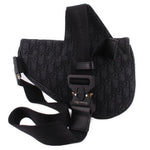 Black saddle crossbody bag with magnetic snap flap and adjustable webbing strap