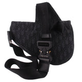 Black saddle crossbody bag with magnetic snap flap and adjustable webbing strap