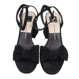 Black suede heeled sandals, open toe with bow accents, ankle straps